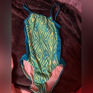 green and blue spaghetti strap gymnastics leotard